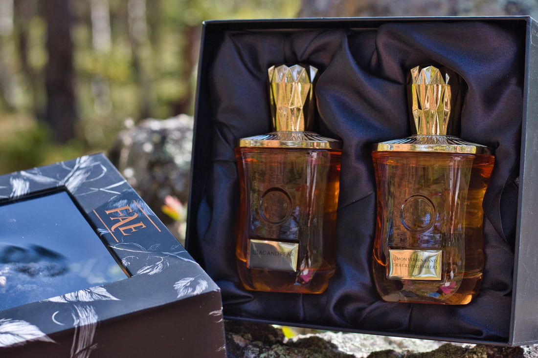Fae Perfume FMC gift box open in forest light, with its botanical box lid.