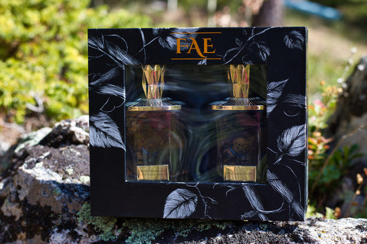 Fae Perfume gift set with Lemon Verbena and Crackling Embers and Pine and Snow bottles.